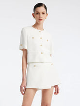 a woman in white two-piece set